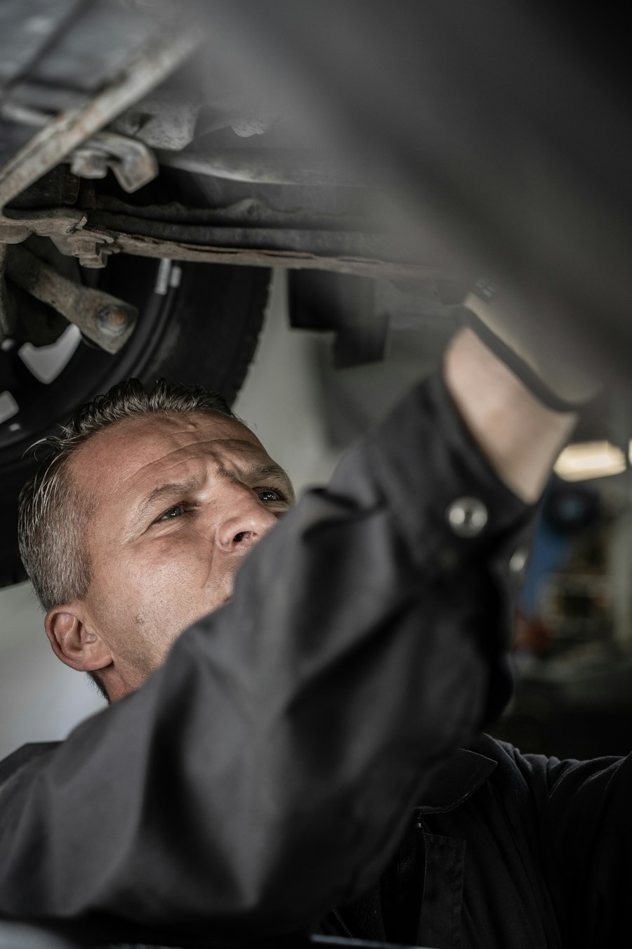 Mechanic working underneath a car